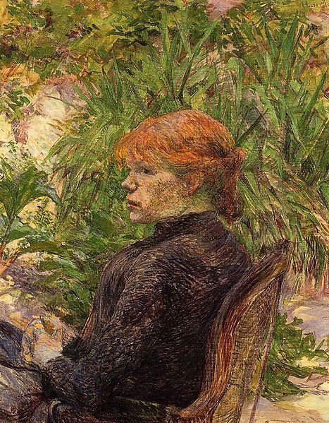 Red Haired Woman Sitting in Conservatory